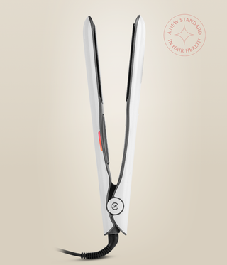 Side view of the Pearl White Omnia Styler Classic standing open, showing its hinge and cord.