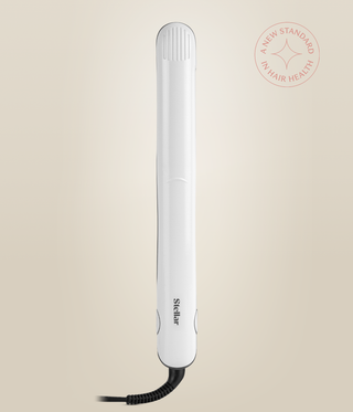 Front view of the closed Pearl White Omnia Styler Classic, with Stellar logo and cord.