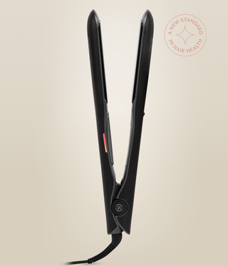 Side view of the Astral Black Omnia Styler Max standing open, showing its hinge and cord.